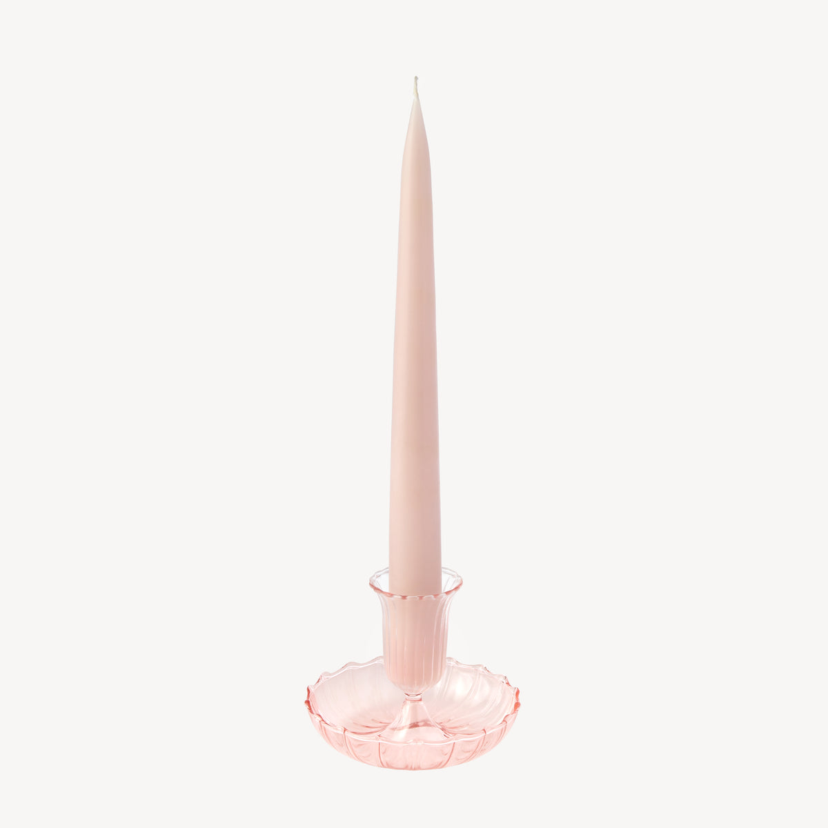 Candle Flair pale pink glass taper candle holder with a scalloped edge with power pink taper