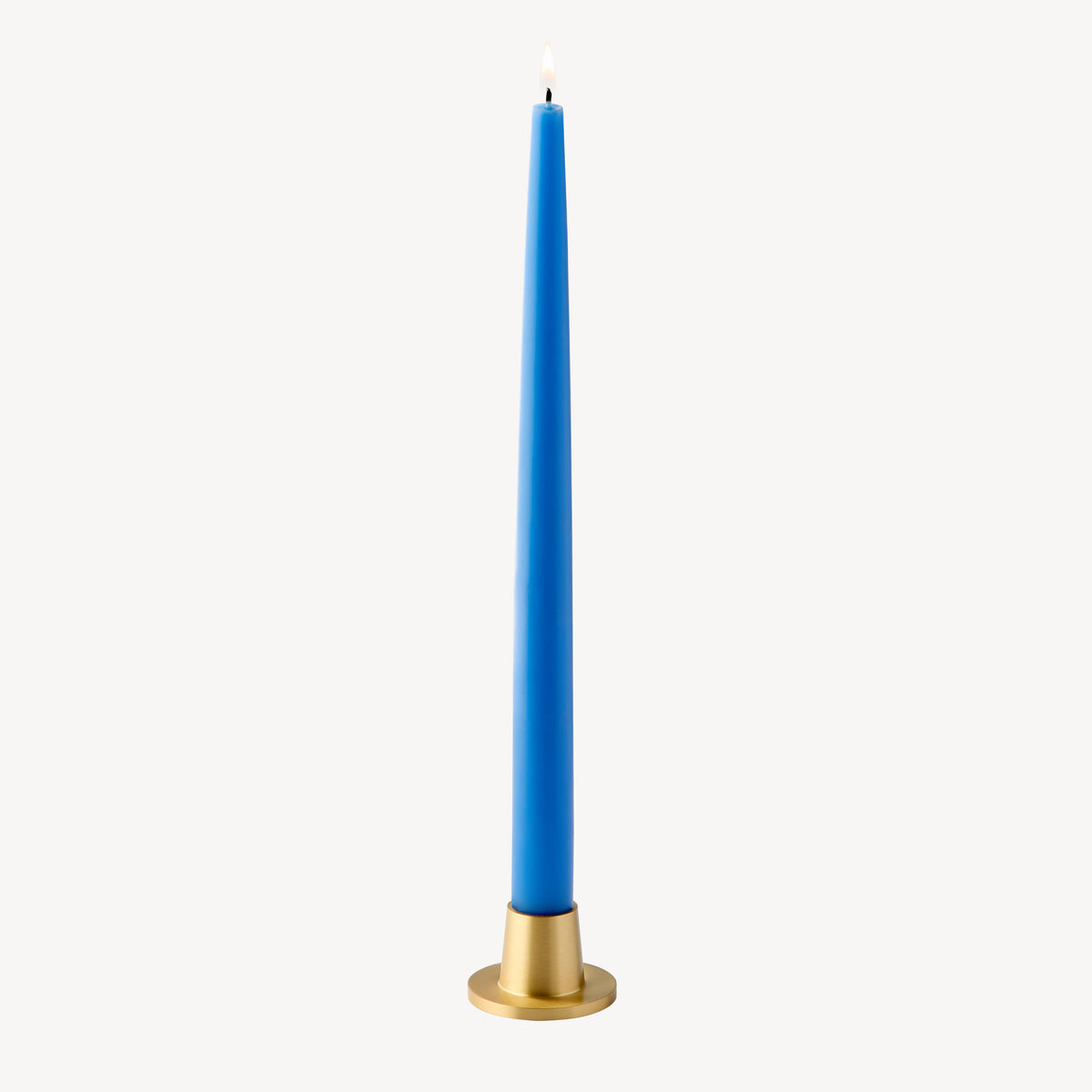 Candle Flair Mono taper candle holder in satin brass with wedgewood blue taper